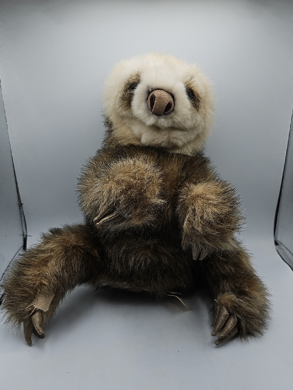 Folkmanis Baby Sloth hand puppet, featuring a realistic design soft plush fur